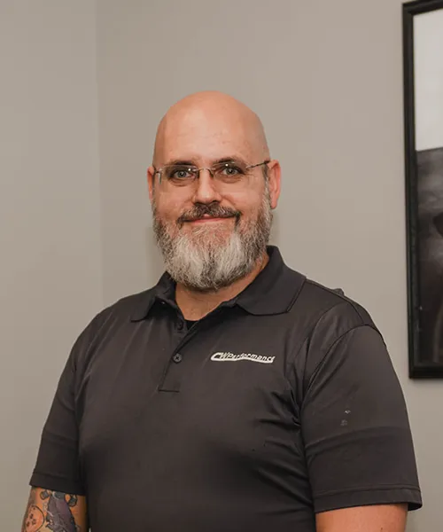 Smiling man with glasses and beard