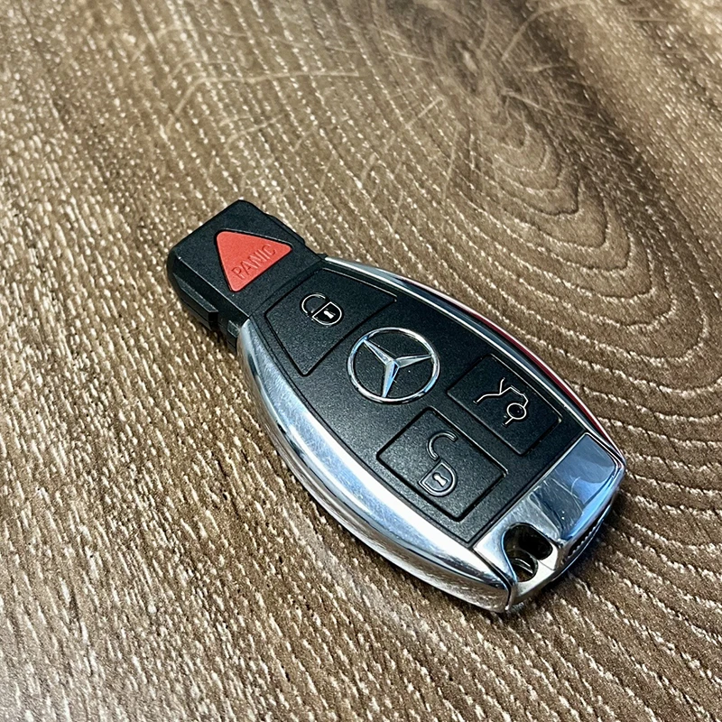 Mercedes-Benz car key on wood