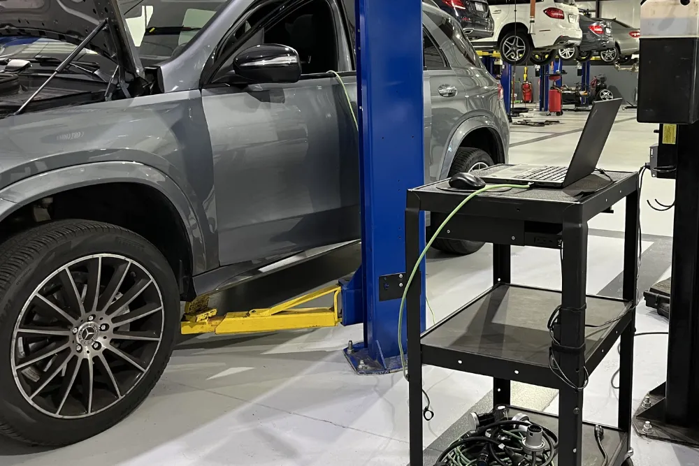 Car on lift with diagnostic equipment